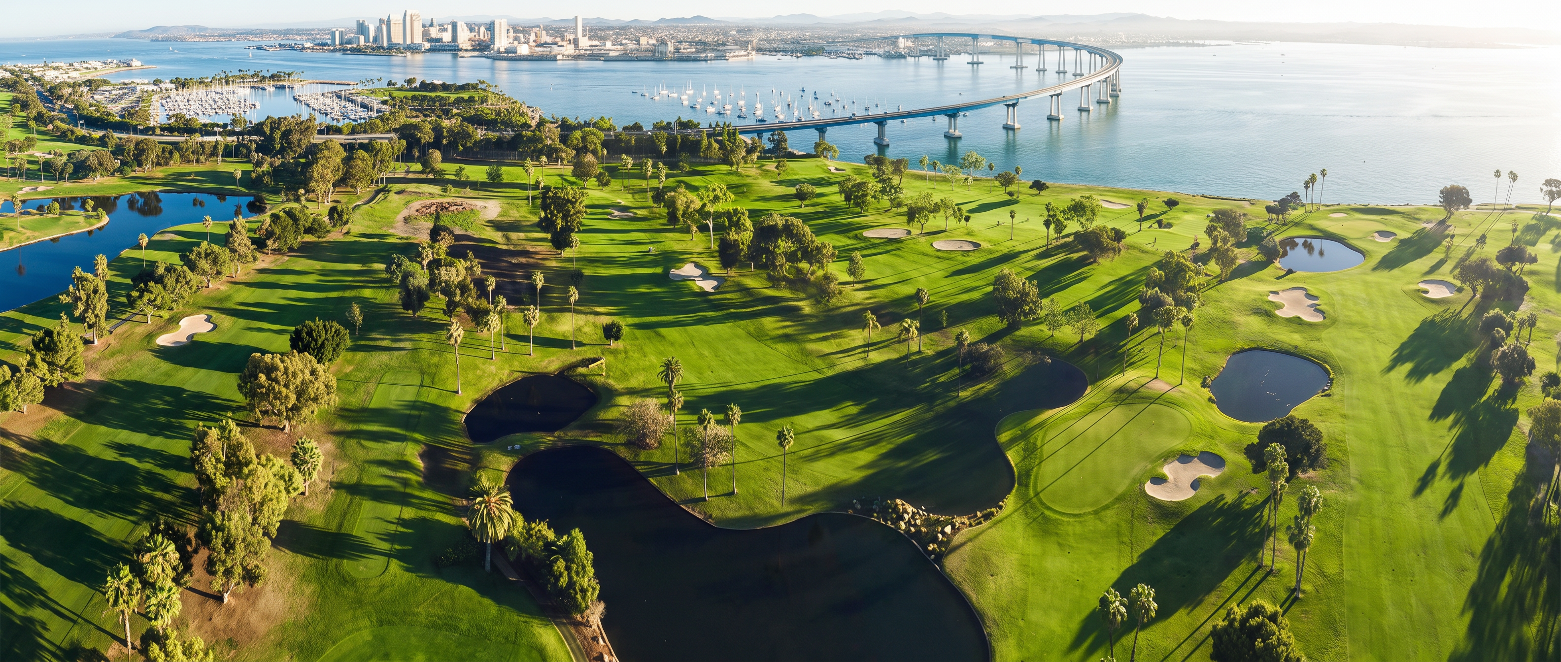 Aerial view of Coronado golf course with bay and bridge